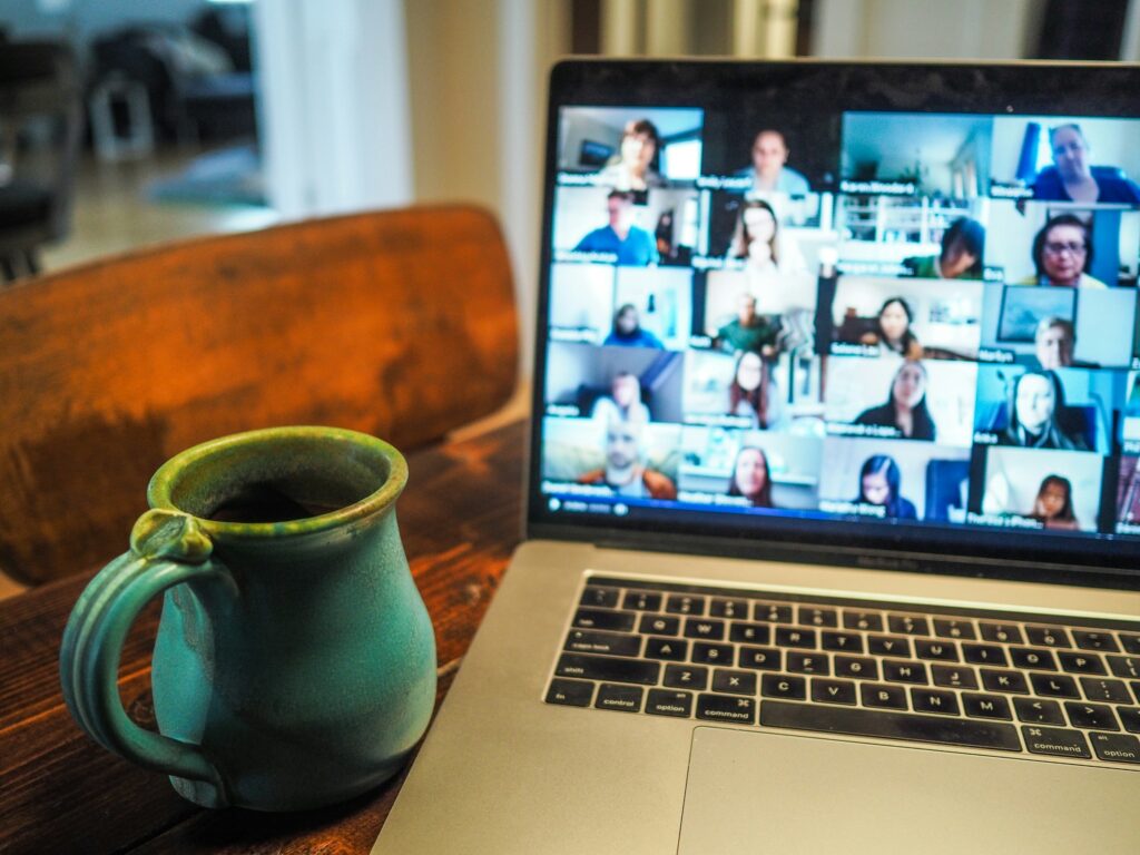 Laptop screen showing a video call with team members