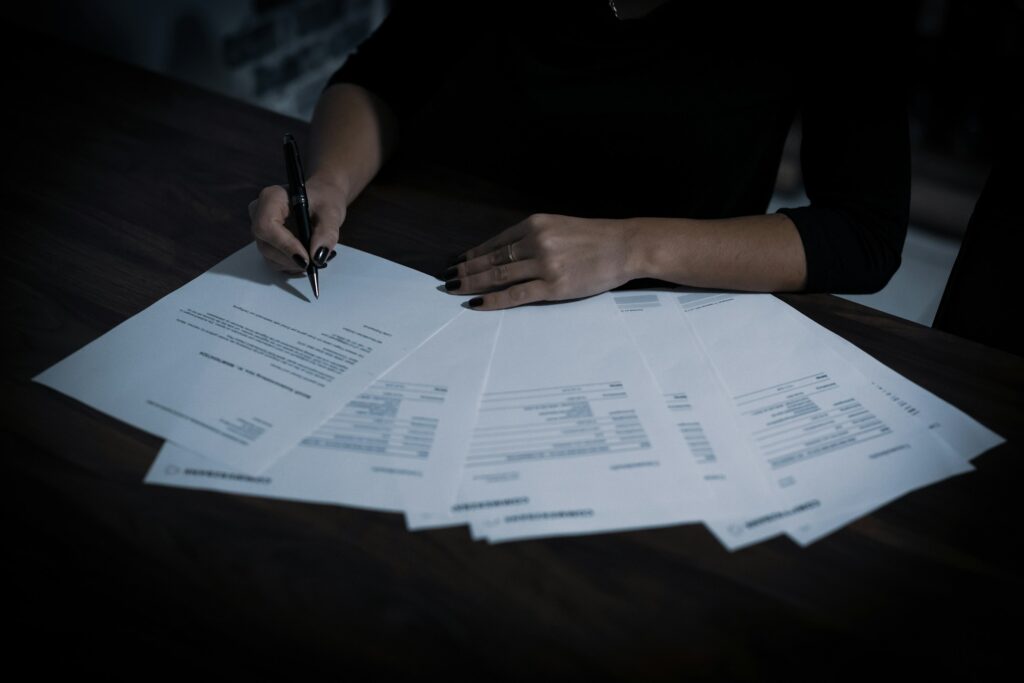 Close-up of hands working with documents