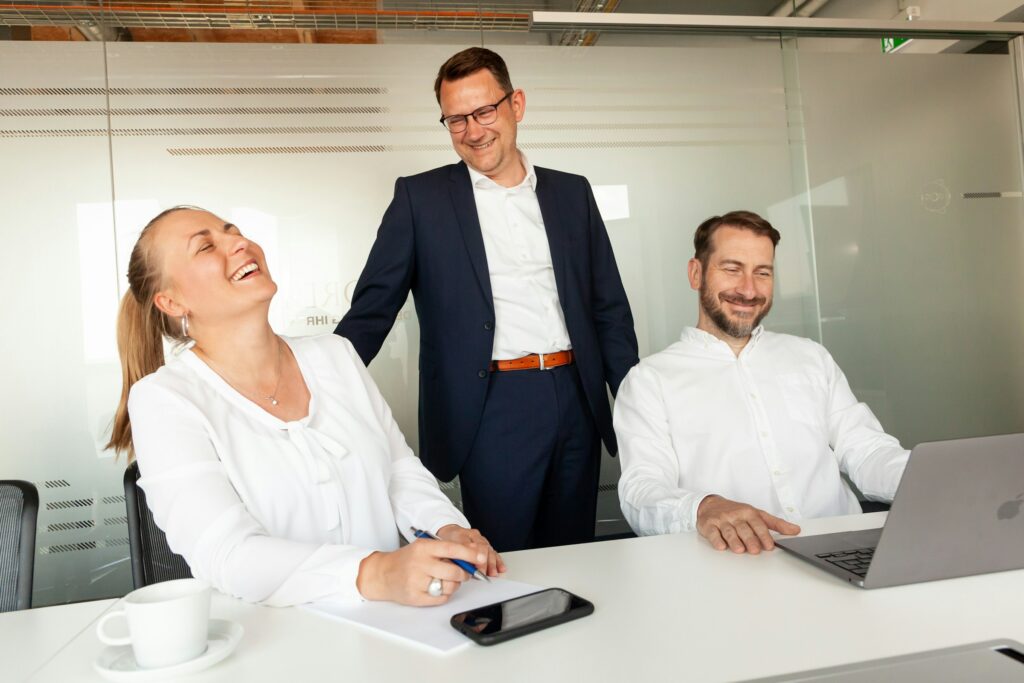 Man in a suit laughing joyfully