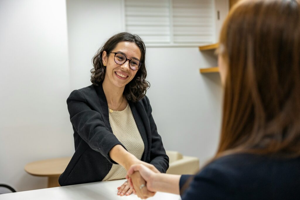 Close-up of a resume document with reading glasses