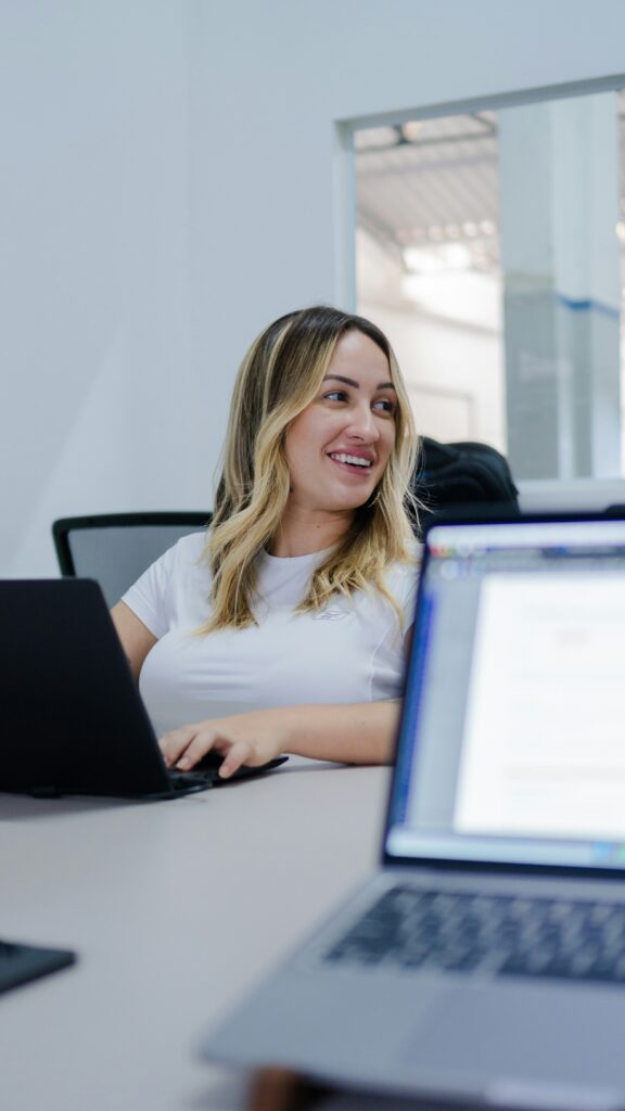 Woman smiling at her desk in an office