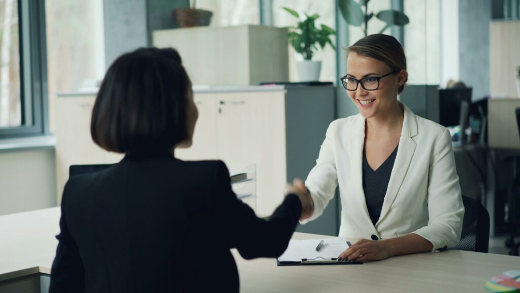 Woman smiling confidently in a modern office