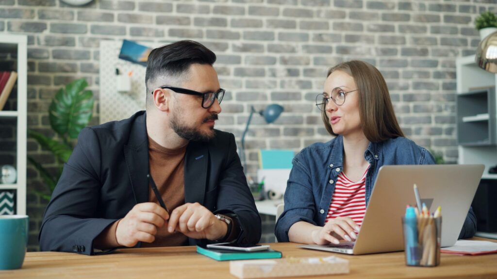 Two colleagues having a discussion in the office
